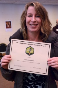 Holly Guncheon, one of the original promoters of creating a Giving Garden at Epiphany, proudly shows off the Golden Beet Award.